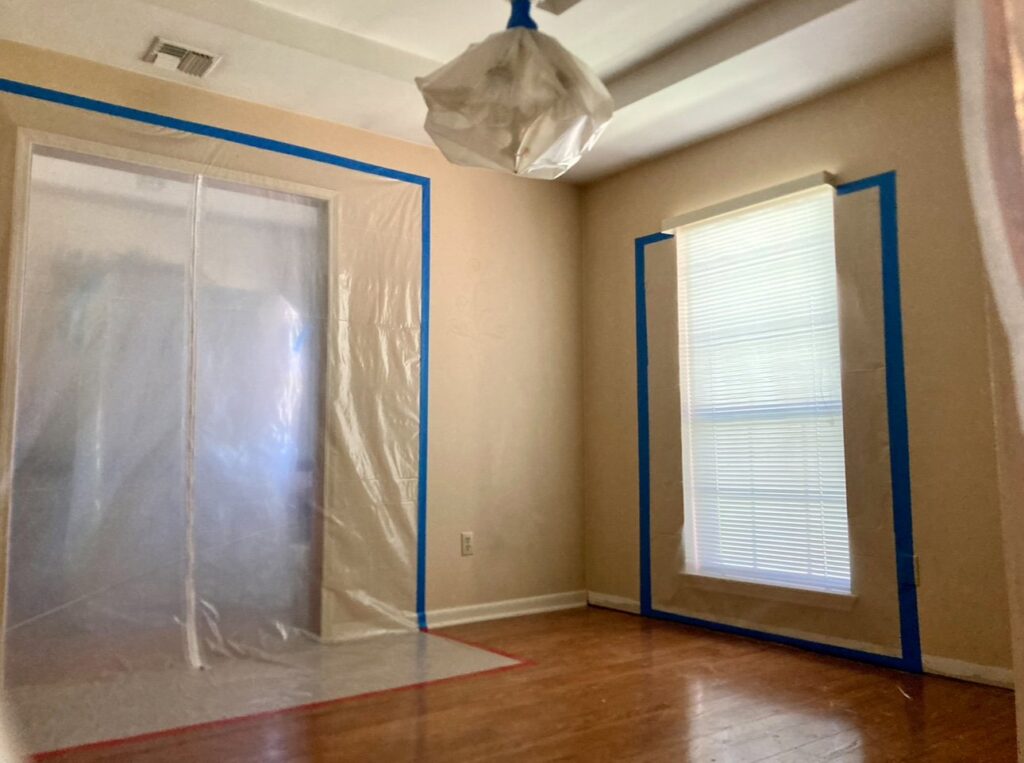 Room with plastic containment and a drying fan for water damage remediation by 1st Response Emergency Repairs, LLC in Scott, LA.