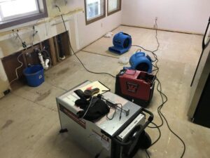 Room with removed drywall and water damage drying equipment from Complete Restoration and Construction, LLC in Yakima, WA