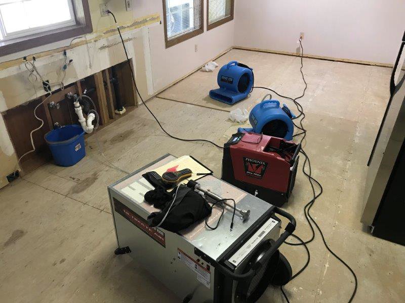 Room with removed drywall and water damage drying equipment from Complete Restoration and Construction, LLC in Yakima, WA
