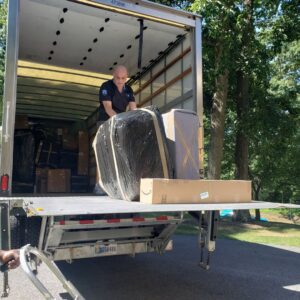 A room filled with various moving boxes and furniture, prepared by Household Goods Moving and Storage in Rockville, MD