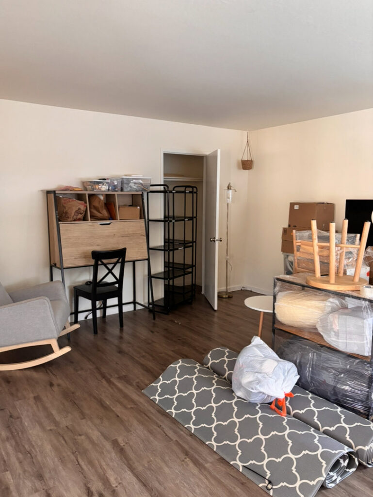 A room with packed boxes and furniture, indicating a move in progress by IMoving Professional Moving System Inc. in San Francisco, CA