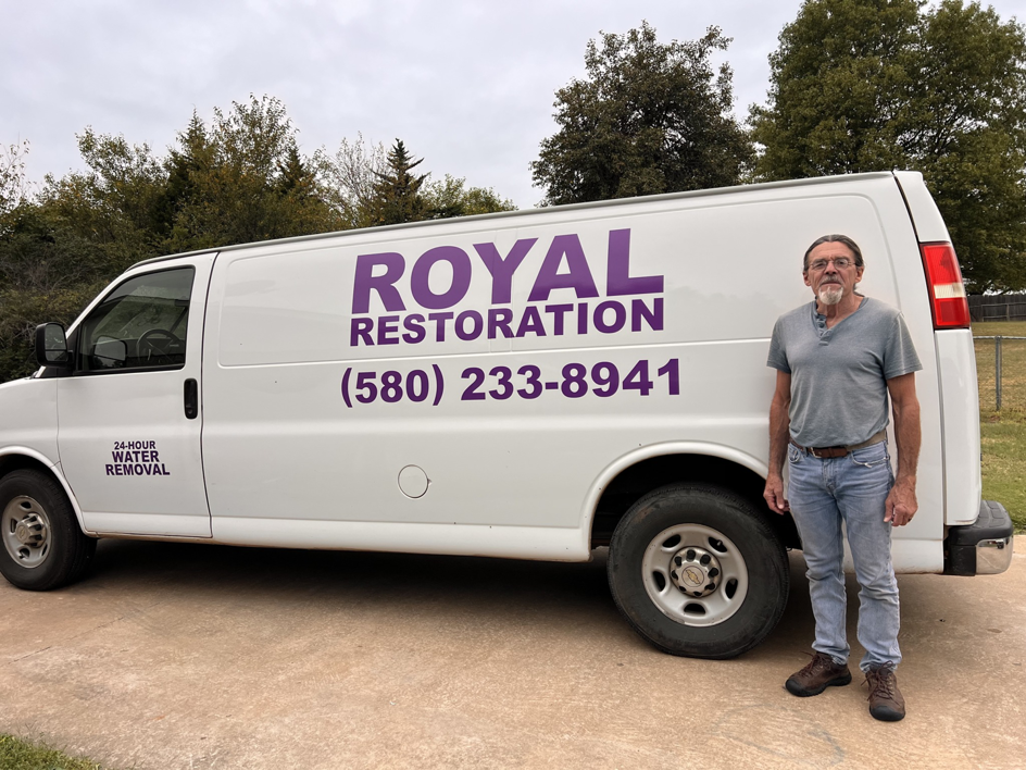 A Royal Restoration service van with '24-HOUR WATER REMOVAL' branding in Enid, OK, ready for emergency jobs.