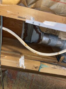 Rusted ductwork and water-stained wooden beams, showing severe water damage, handled by Acclaim Restoration in Harrisburg, PA