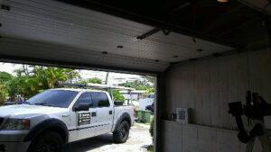 A Central Garage Door Service truck parked inside a garage during a service call in Kapolei, HI.