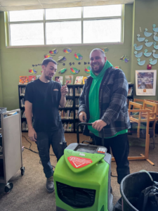 SERVPRO North Kenosha technicians operating water extraction equipment on a job site in Kenosha, WI.