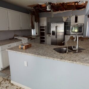 Kitchen showing severe water damage with a collapsed ceiling and debris, requiring restoration by Built Different Restoration in Gilbert, AZ.