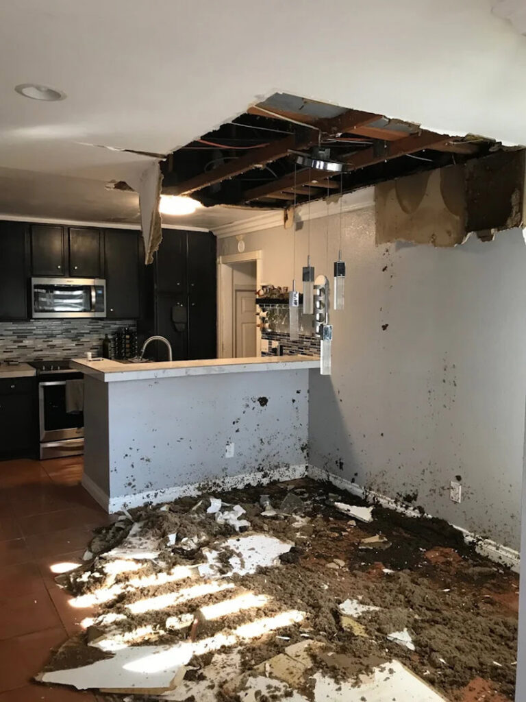 Severe water damage in a kitchen with a collapsed ceiling, requiring restoration by EZ Water Damage Restoration Services, Chula Vista, CA.