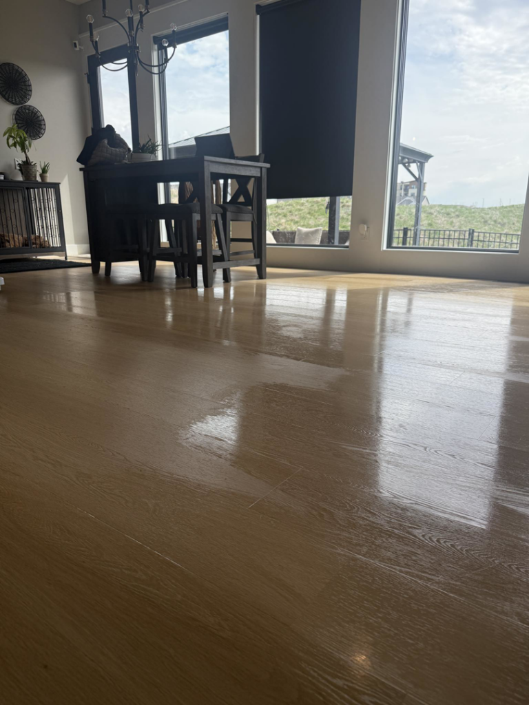 A beautifully shiny and clean hardwood floor, showcasing the results of Simplicity house cleaning in Davenport, IA