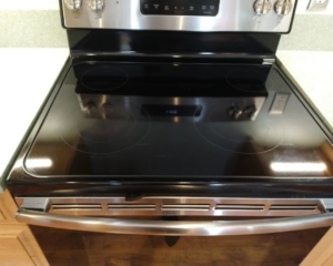 A gleaming, clean stovetop and oven front, expertly cleaned by Sunrise Cleaning in Saint Petersburg, FL.