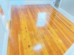 A shiny light hardwood floor in a freshly cleaned room by Sanchez Cleaning Service, LLC in San Antonio, TX.