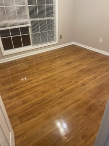 A sparkling clean wood floor in a bedroom, demonstrating the quality cleaning by The Clean Solution in Eagle Lake, TX
