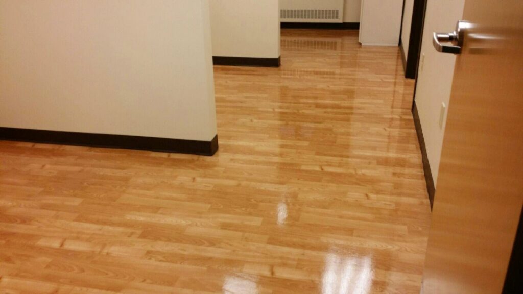 A beautifully cleaned and shiny wooden floor in a home, reflecting the quality of Clean Slate Cleaning Service in Green Bay, WI.