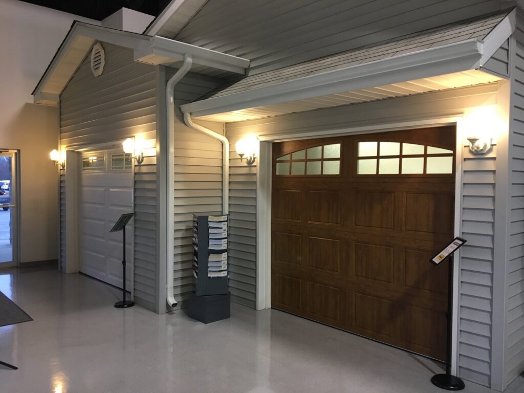 Two different garage door models on display in the showroom of Hickman Overhead Door in Milford, DE.