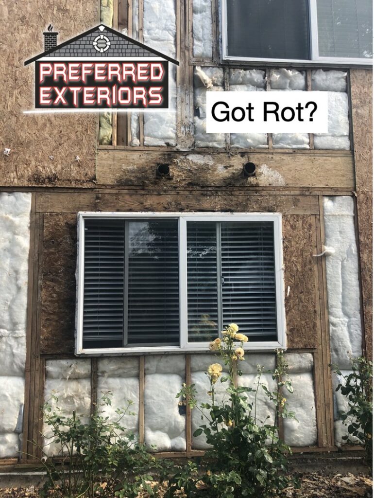 Close-up of a house wall with siding removed, revealing rot and water damage, handled by Preferred Exteriors in Roswell, GA