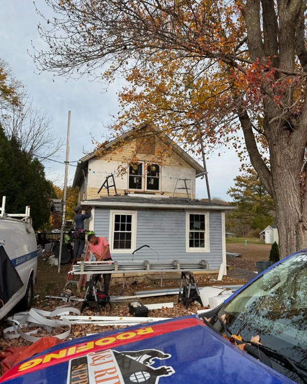 Siding installation in progress on a house by J&J Rivera Roofing and Supply Co in Old Saybrook, CT