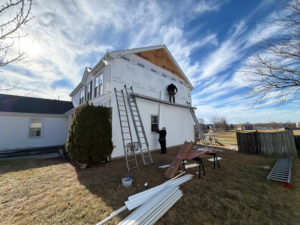 Siding installation in progress on a residential home by Legend Exteriors & Construction in West Chicago, IL