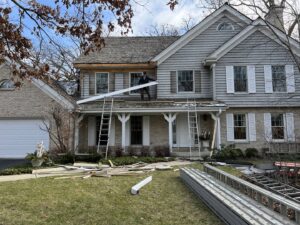 Siding removal in progress on a house by SmardBuild Siding and Exteriors in Naperville, IL