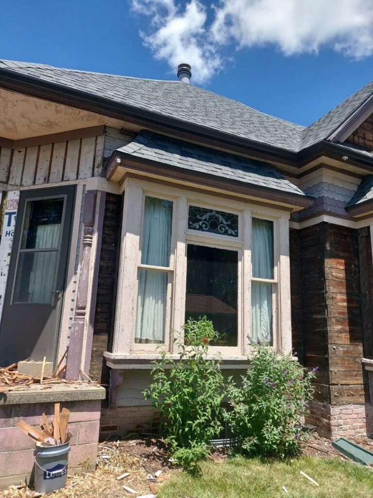 An old house undergoing siding removal and exterior renovation by Freeman Exteriors in Danville, IL.