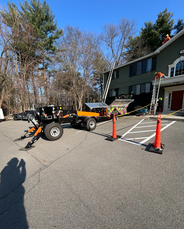 A siding work site with green ZIP System sheathing and a debris chute by KC Entities Roofing and Siding in Mechanicville, NY
