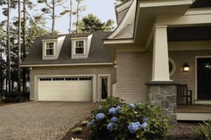 A residential garage with a single white panel garage door, a service from Overhead Door Co of Missoula in Missoula, MT.