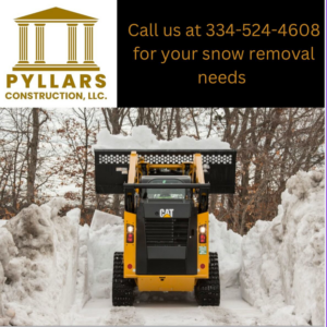 A yellow skid steer with a snow bucket clearing a path through deep snow by Pyllars Construction, LLC in Olive Branch, MS