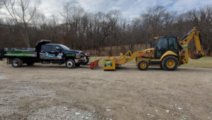 A Mr. Frosty Snow Removal branded truck with a snow blower attachment, ready for snow removal services in Springfield, IL.