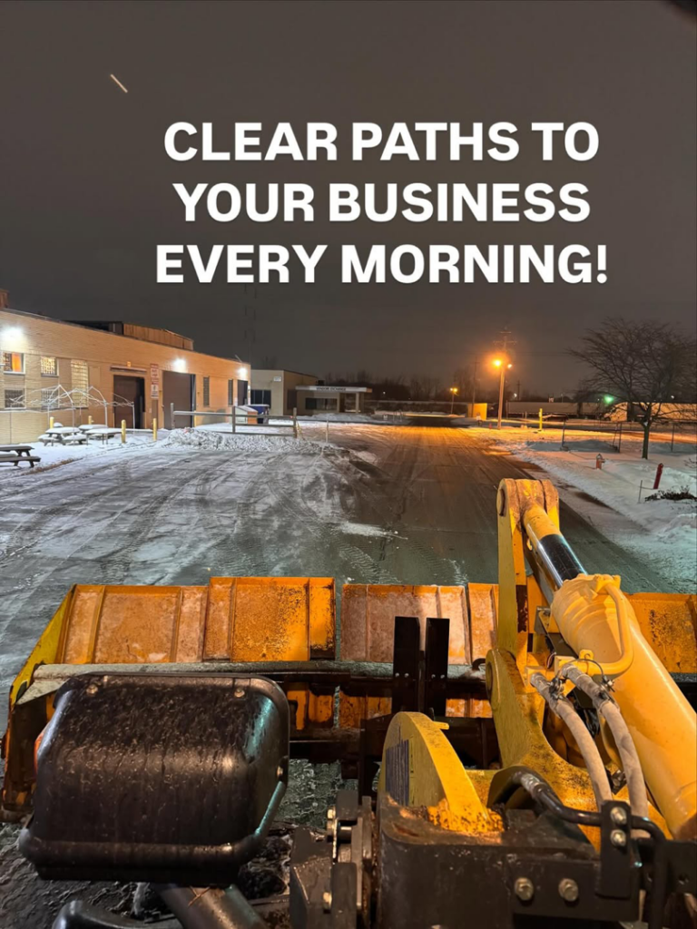 A snow plow clearing a parking lot at night, ensuring clear paths for businesses by Greenscape USA, Inc. in Parma, OH.