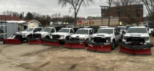 A fleet of snow plow trucks ready for service from Simply Snow & Lawn LLC in Madison, WI.