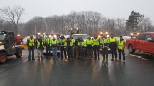 A dedicated team of snow removal professionals with their equipment ready for action by The Groundskeeper Inc. in Fort Collins, CO.
