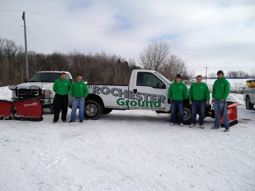 The snow removal team with trucks and plows ready for work at Rochester Ground Lawn & Snow Services in Rochester, MN.