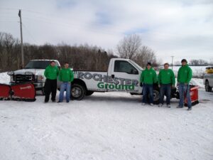 The snow removal team with trucks and plows ready for work at Rochester Ground Lawn & Snow Services in Rochester, MN.