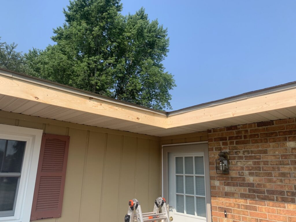 Close-up of soffit, fascia, and siding repair work on a house by Freeman Exteriors in Danville, IL.