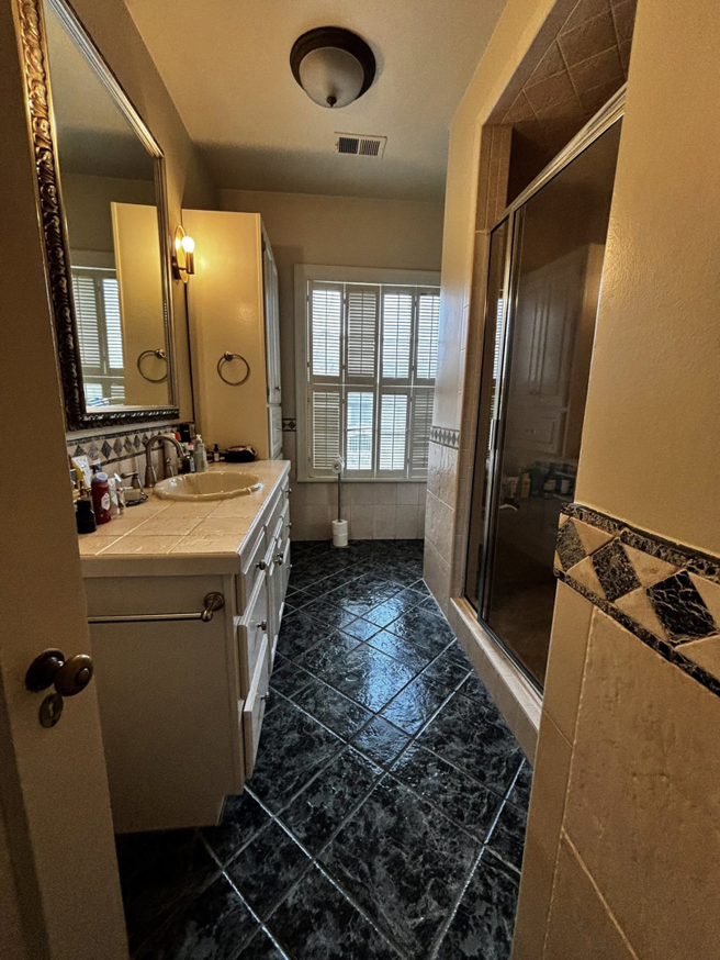 A sparkling clean tiled bathroom floor, reflecting the high-quality house cleaning services from BuzzSide Cleaning LLC in Little Rock, AR.