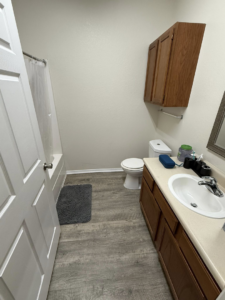 A sparkling clean and organized bathroom, showcasing the results of WWJM Cleaning Service in Oklahoma City, OK.