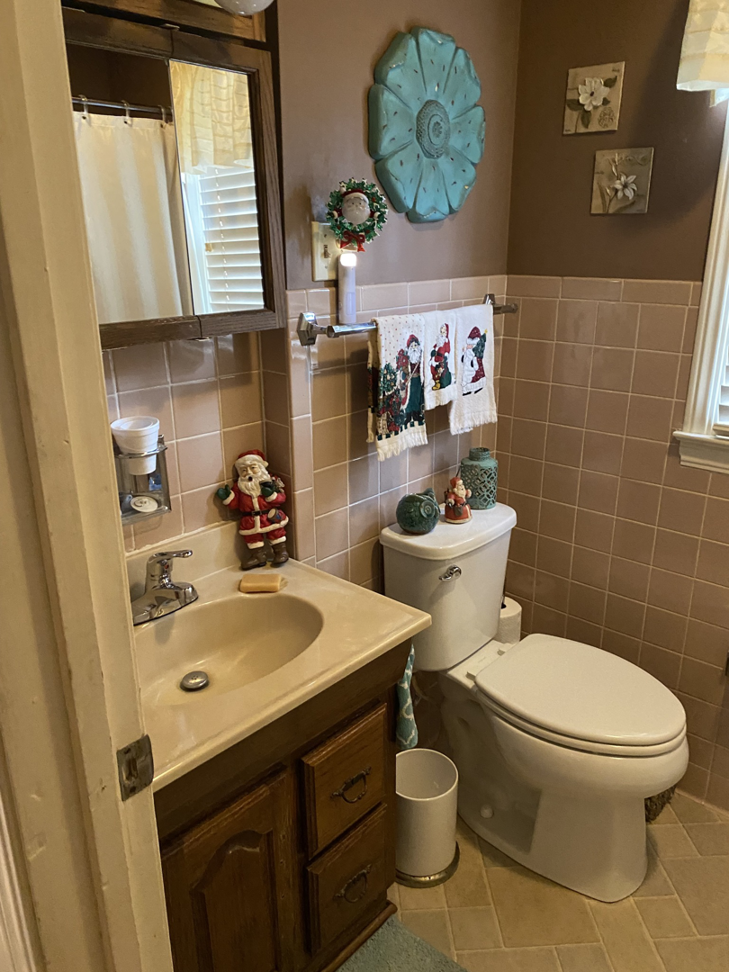 A sparkling clean bathroom with a sink and toilet, maintained by Astral Cleaning Service in Topeka, KS.