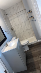 A sparkling clean bathroom with a modern vanity and shower, expertly cleaned by Jr services in Virginia Beach, VA.