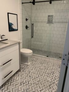 A sparkling clean bathroom with a shower, toilet, and vanity, meticulously cleaned by Simply Clean Jax in Jacksonville, FL.