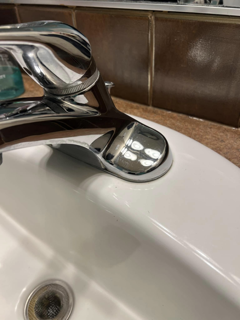 A sparkling clean bathroom sink faucet after professional cleaning by Idaho Gem Cleaning in Caldwell, ID.