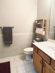 A sparkling clean and organized bathroom, showcasing the meticulous work of Sudz Up Cleaning Company in Columbia, MO.