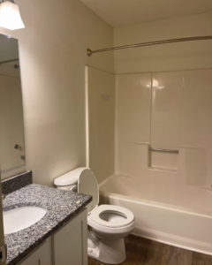 A sparkling clean bathroom with a toilet, vanity, and tub, cleaned by Per Your Request Richmond in Glen Allen, VA.
