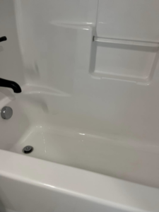 A sparkling clean white bathtub after professional house cleaning by Blue Line Cleaning Services in Rock Hill, SC.