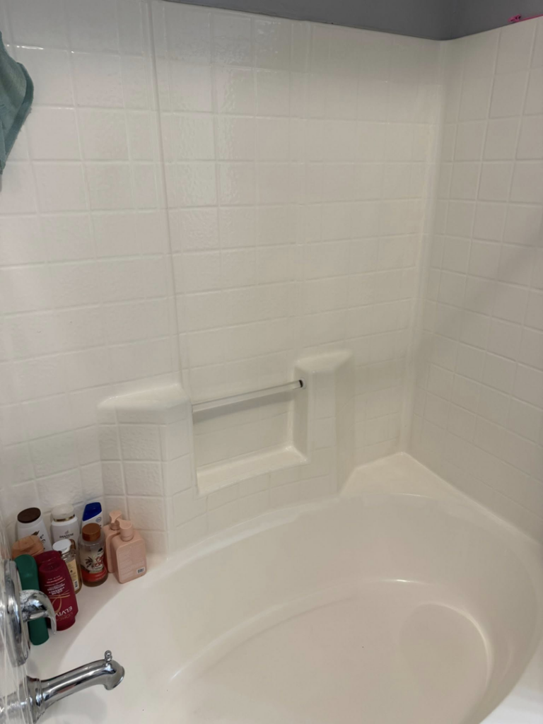 A sparkling clean bathtub and shower area, professionally cleaned by Maribel's Cleaning Services in Raleigh, NC.