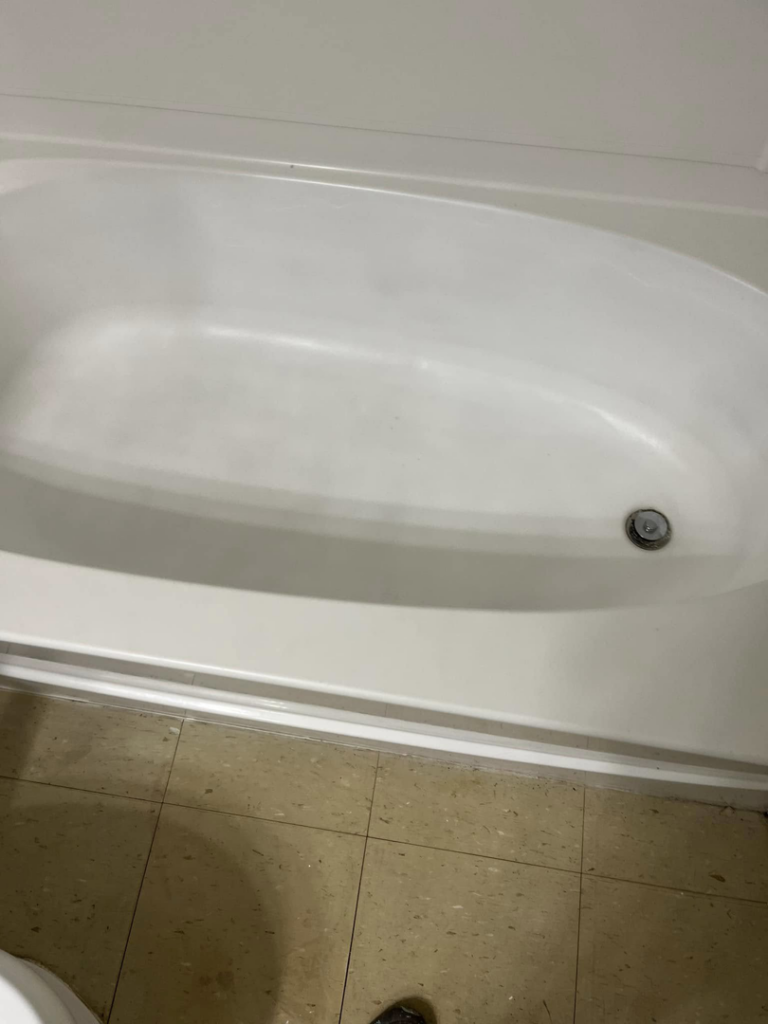 A sparkling clean bathtub after professional cleaning by Right Now Cleaning Services in Toledo, OH.
