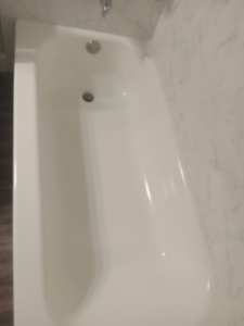 A sparkling clean bathtub from a top-down view, highlighting the meticulous cleaning services provided by Dacari's Helping Hands LLC in South Bend, IN.