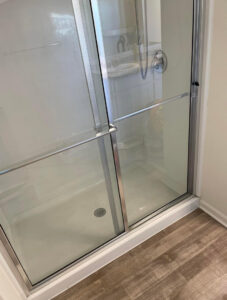 A sparkling clean glass shower stall, meticulously cleaned by Maid In Indy in Indianapolis, IN.
