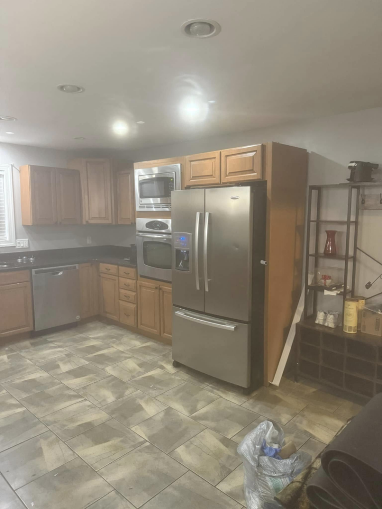 A sparkling clean kitchen with stainless steel appliances after a professional cleaning service by Chelle's Cleaning Services in Gary, IN.