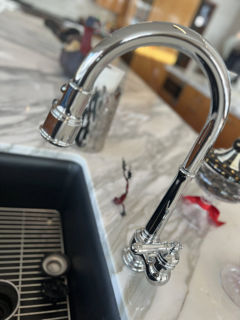 A sparkling clean kitchen faucet and sink area, showcasing the detailed cleaning by Home Clean Home By Maria LLC in Aberdeen, SD.