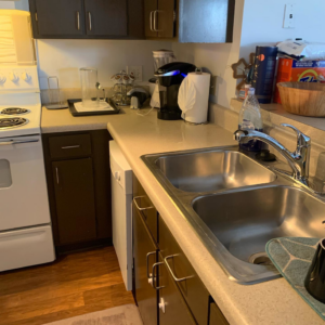 A sparkling clean kitchen sink and countertop after a professional cleaning service by Premier Uptown Clean in Charlotte, NC