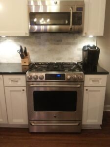 A sparkling clean kitchen stove and microwave, showcasing the quality work of Jessie Clean in Indianapolis, IN.