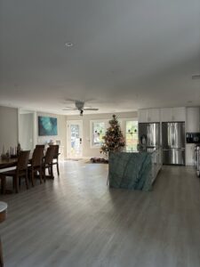 A sparkling clean and tidy open-plan living room and kitchen area, showcasing the results of Cleaning Sisters LLC's service in Richmond, VA.